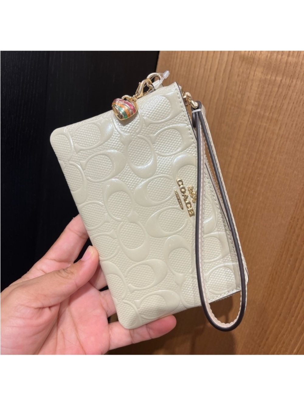 Coach Corner Zip Wristlet In Signature
Leather With Heart Charm